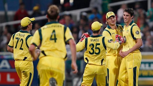 The Australians celebrate with Patrick Cummins.