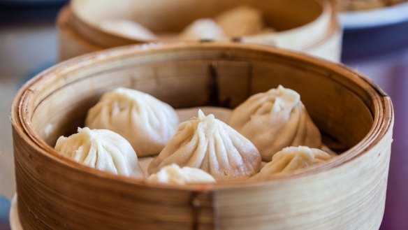 Traditional soup dumpling xiao long bao is a popular Chinese dim sum steamed in bamboo steamers.