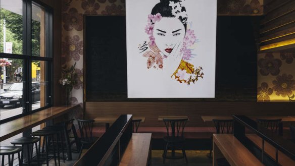 A portrait dominates the Soi Noodle Bar interior.