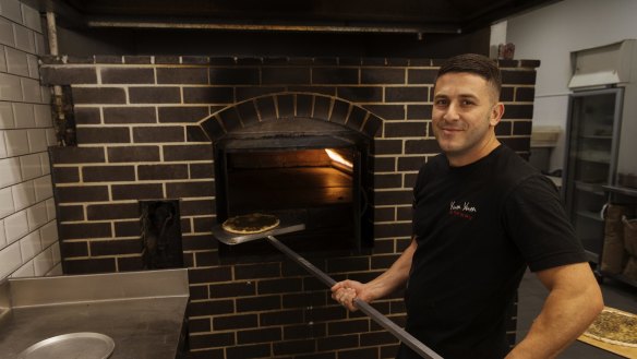 Najib Haddad working the oven at Yum Yum Bakery, Guildford. 