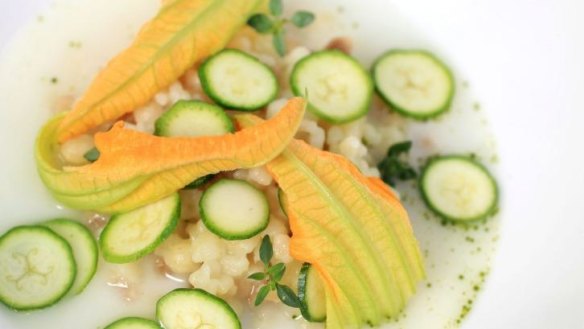 Pecorino consomme with fregola and zucchini flowers.