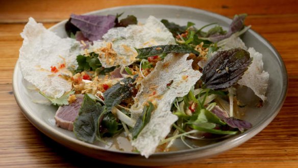 Seared tuna served with fresh herbs, green papaya and rice-paper crisps.