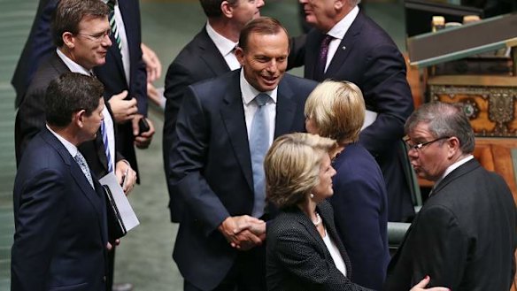 Prime Minister Tony Abbott shakes hands with Labor MP Jenny Macklin after delivering the Closing the Gap report.  Photo: Alex Ellinghausen