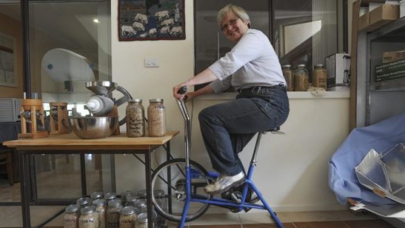 Feet to the grindstone: Cindy Steensby exercises her right to organic milling.