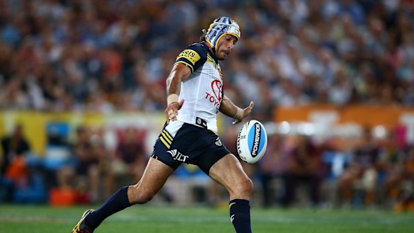 The moment: Johnathan Thurston on his way to nailing the match-winning field goal in golden point extra time.