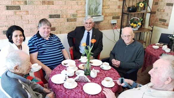 Aged Care Minister Ken Wyatt meets residents at a facility.