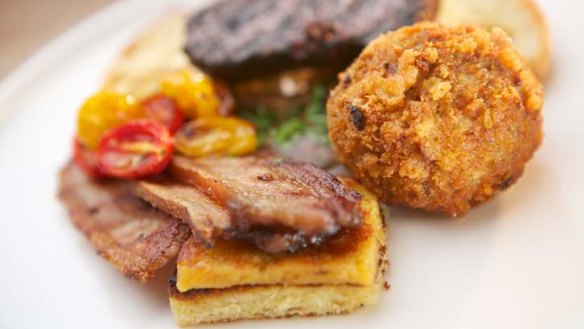 British breakfast of Scotch egg, black pudding and Welsh rarebit with home-made HP sauce.