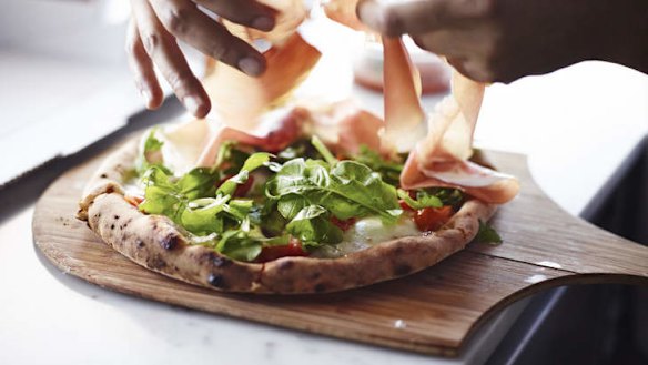 A prosciutto pizza in the making.