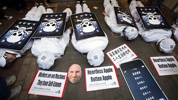 Local and mainland Chinese university students play dead to highlight the cause of Apple factory workers.