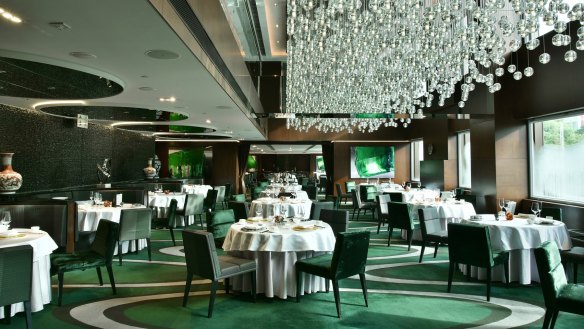 Cuisine Cuisine's glitzy jade green interior.