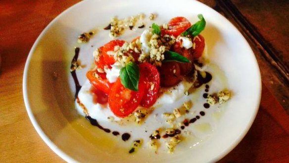 Baby tomatoes and mozzarella with granola and balsamic.