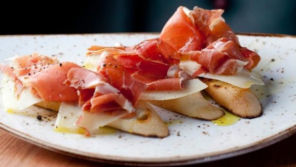 Carmen Sevilla: baguette slices rubbed with tomato and olive oil, topped with manchego and jamon.