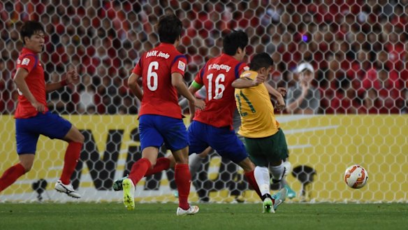 Massimo Luongo fires home the opening goal for the Socceroos. 