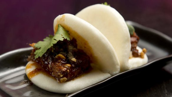 Red dragon sauce and pickled daikon jazz up a pair of pork belly bao.