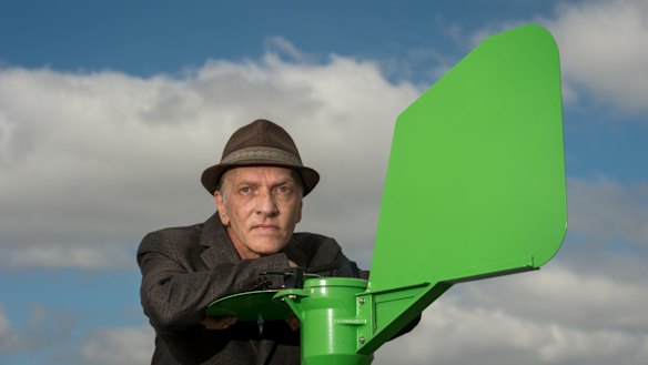 Environmental allergist Dr Philip Taylor, with a pollen counter on a building at Deakin University’s Burwood campus.