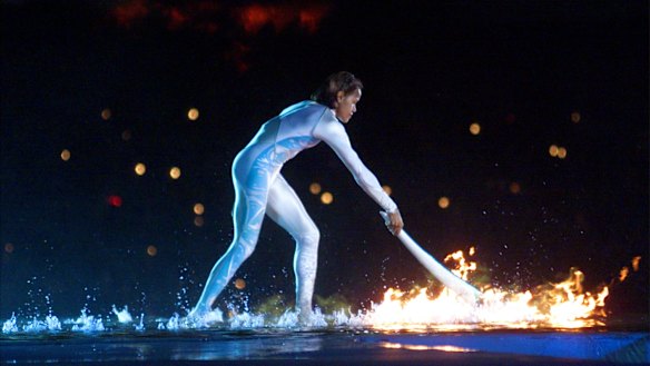 Australian Olympic athlete Cathy Freeman ignites the Olympic flame during the opening ceremony for the Summer Olympics.