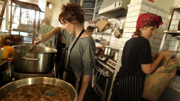 Food economy: Alex Elliott-Howery and Jaimee Edwards pickle pears at Cornersmith Cafe.