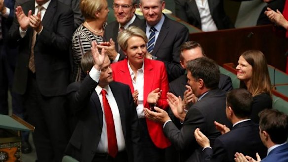 Opposition Leader Bill Shorten acknowledges applause from the public gallery after delivering the budget reply.