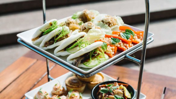 Peking duck buns and more: Opera Bar's two-tiered tasting platter.