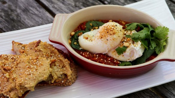 Moroccan eggs served with hummus and dukkah on sourdough.