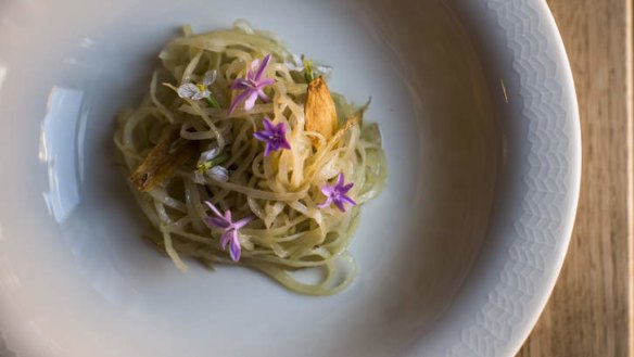 Par-cooked potato with society garlic flowers.