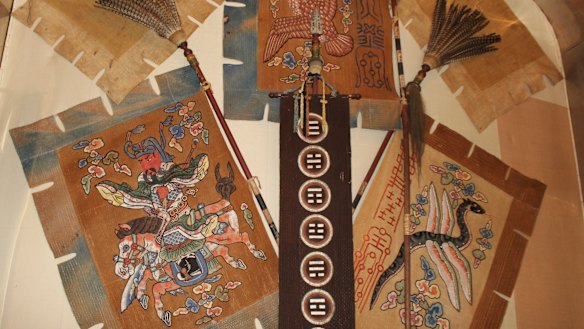 Flags found behind War of 1812 flags in Mahan Hall at the US Naval Academy Museum in Annapolis, Maryland. Records indicated display boxes long used to exhibit captured British banners from the War of 1812 concealed more flags underneath. 