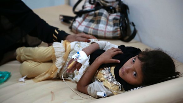 A girl is treated for a suspected cholera infection at a hospital in Sanaa, Yemen, in July. 