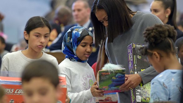 First lady Michelle Obama helps sort toys and gifts for the Marine Corps' Toys for Tots Campaign at Joint Base Anacostia-Bolling in Washington.