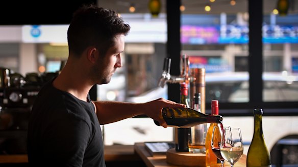 The Hills Wine Bar's manager Angus Brettingham-Moore pours a legal drop in "dry zone" Surrey Hills.
