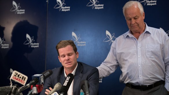 Emotional: Steve Smith addresses the media at Sydney Airport, with father Peter standing behind him.
