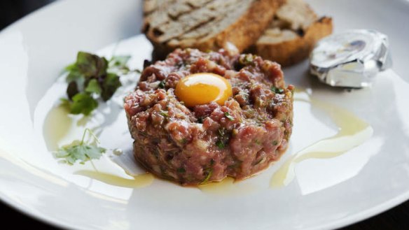 Steak tartare with quail egg yolk.