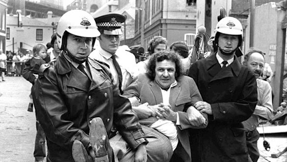 Carried away … Jack Mundey being detained in The Rocks.