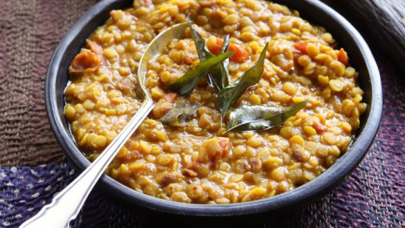 Split peas with cherry tomatoes and fresh curry leaves.