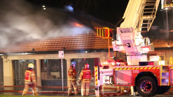 Fire fighters battle the blaze at Donovans restaurant.