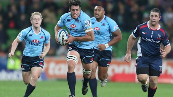 Breakthrough: David Dennis cracks open the Rebels defence. The skipper insists NSW won't settle for second-best this year.