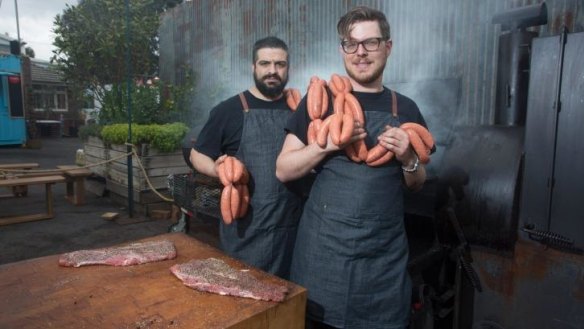 Raphael Guthrie and Steve Kimonides from Burn City Smokers with their smoker.
