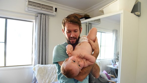 Johnny and Aviana play in her bedroom on her birthday in Darwin.