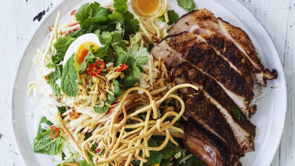 Spiced pork chops with boiled eggs, crispy noodles  and slaw.