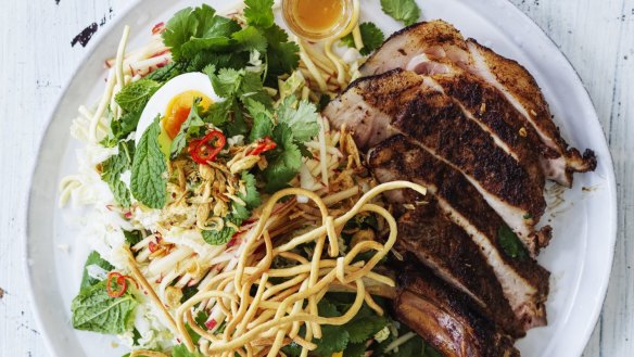 Spiced pork chops with boiled eggs, crispy noodles  and slaw.