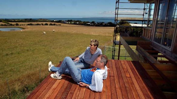 Robert Newall and Karen Green at their house under construction in Ventnor overlooking the proposed development site.