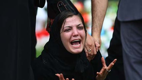 The pain of saying goodbye ...  the burial service for eight-month old  Zahra Ibrahimy in Sydney.