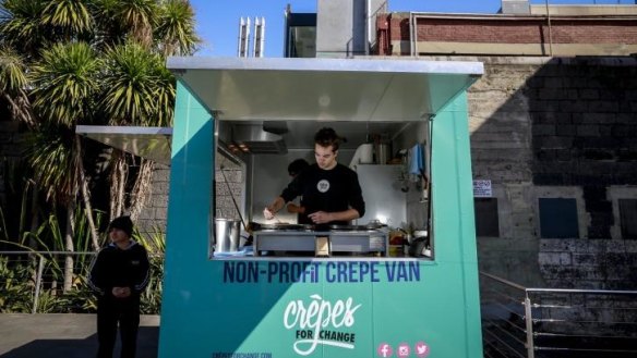 Student Daniel Poole inside his charity food truck.