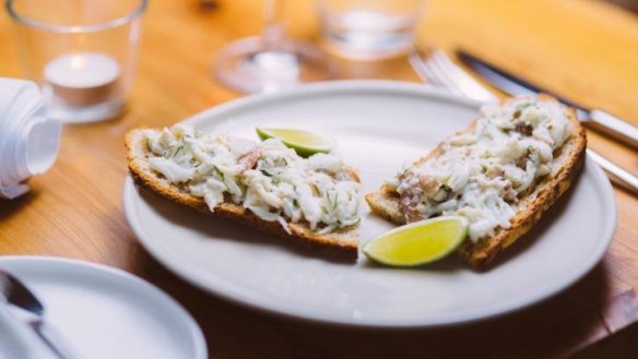 Mud crab with fresh herbs on toast.