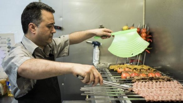 Owner and chef Haydar works at the grill.