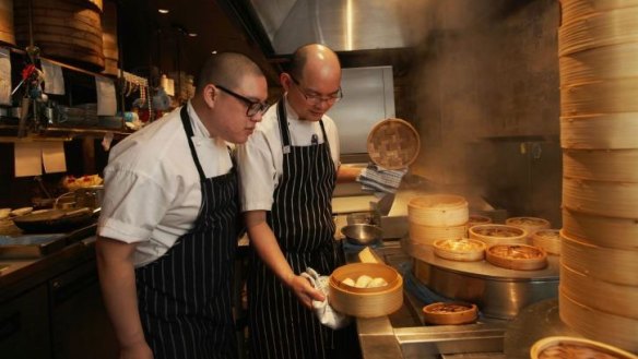 Eric Koh (right) and Mr Wong executive chef Dan Hong on steaming duties.