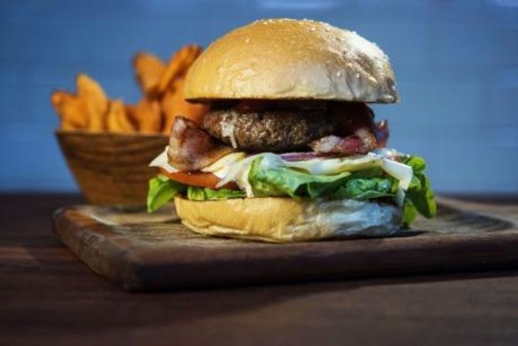 Beef and bacon burger with sweet potato fries.