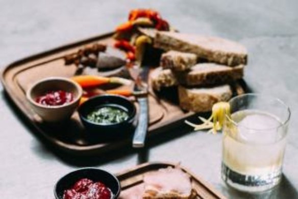 Platters of meats, cheeses and fruit, roots and seeds.