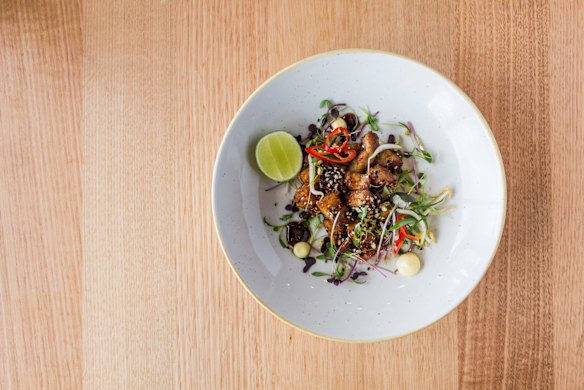 The sticky fried pork belly entree is dished up as a simple Asian-style salad