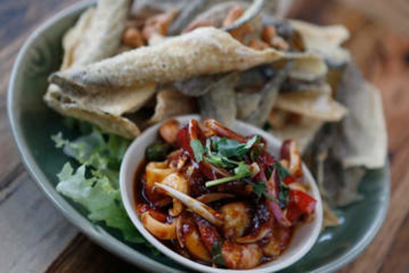 Yum sam grop salad with shards of deep-fried fish skin and tangy tamarind and chilli dressing.