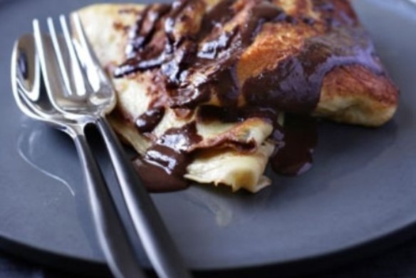 Walnut filled pancakes with chocolate sauce